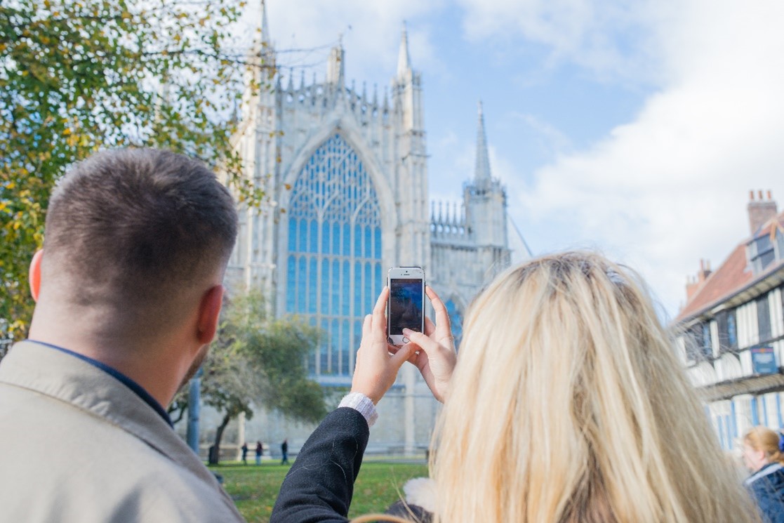 Couple taking a picture of York Minster