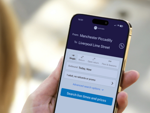 Hand holding a phone with the Northern Rail app on the screen,