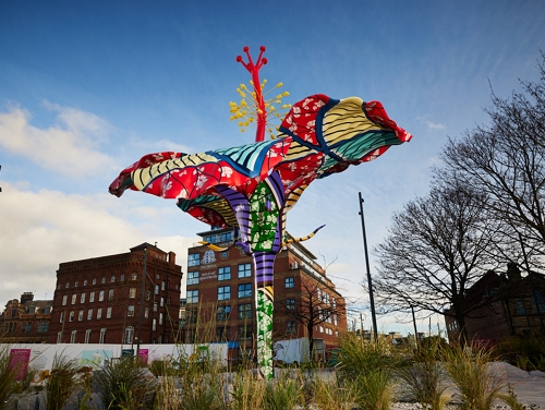 Hibiscus Rising sculpture in Leeds on a sunny day