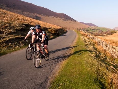 Group of people cycling in countryside