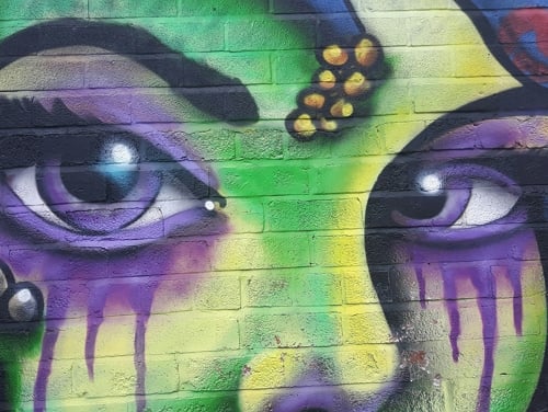 Artistic graffiti of a woman's face in Hull
