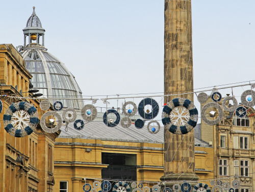 Christmas lights hung up in Newcastle city centre in daylight