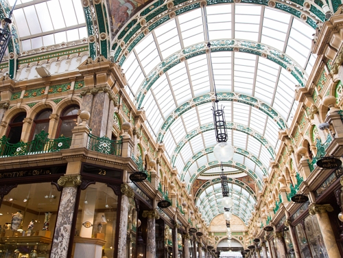 Interior of Victoria Quarter in Leeds with brightly lit windows on the roof