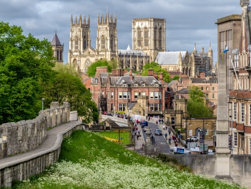 A view of York Minster from the city walls with buildings in the way covering the bottom of the Minster.