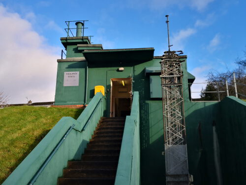 The entrance to York's cold war bunker. There are stairs leading up to a door way, it is all made out of concrete and steel.