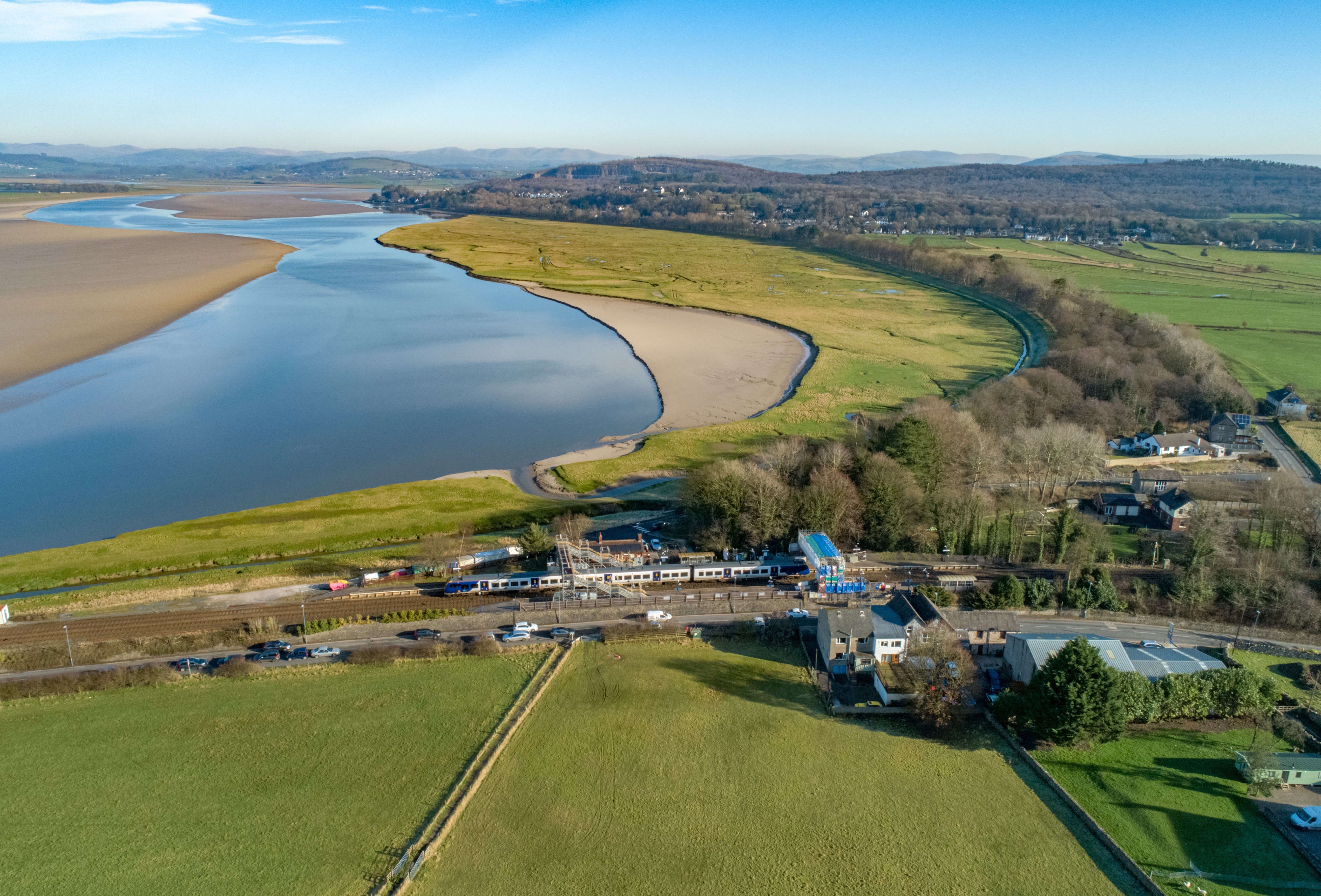 this-image-shows-a-northern-train-travelling-past-arnside