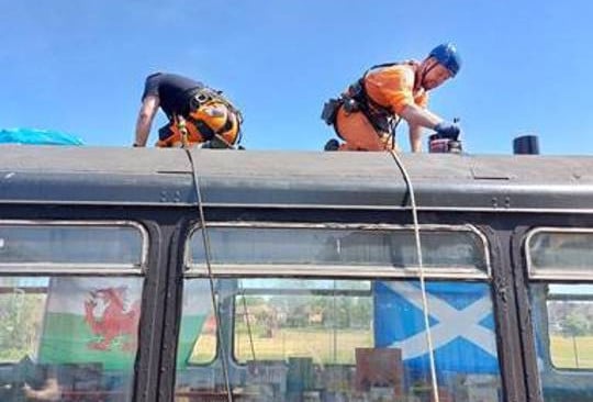 this-image-shows-the-team-repairing-the-leak-to-the-roof