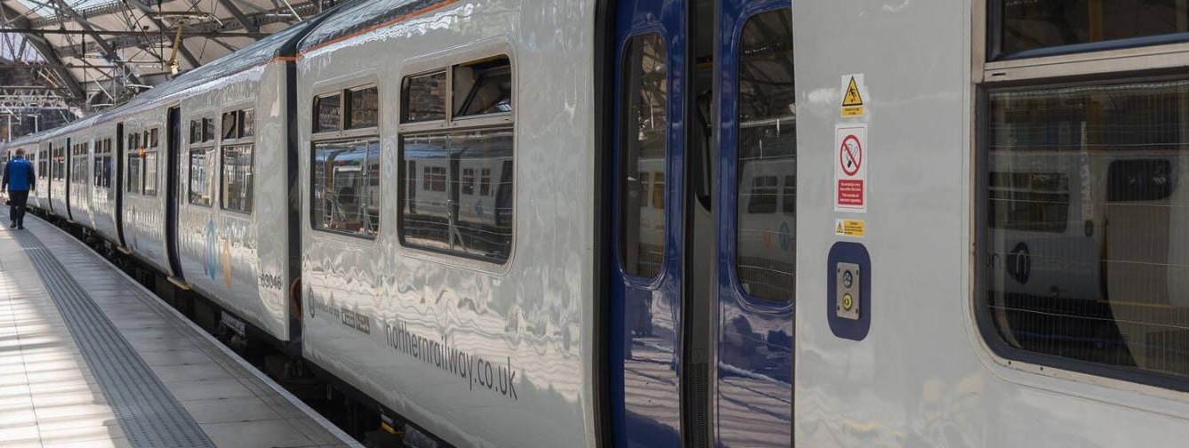 Northern train waiting at a station