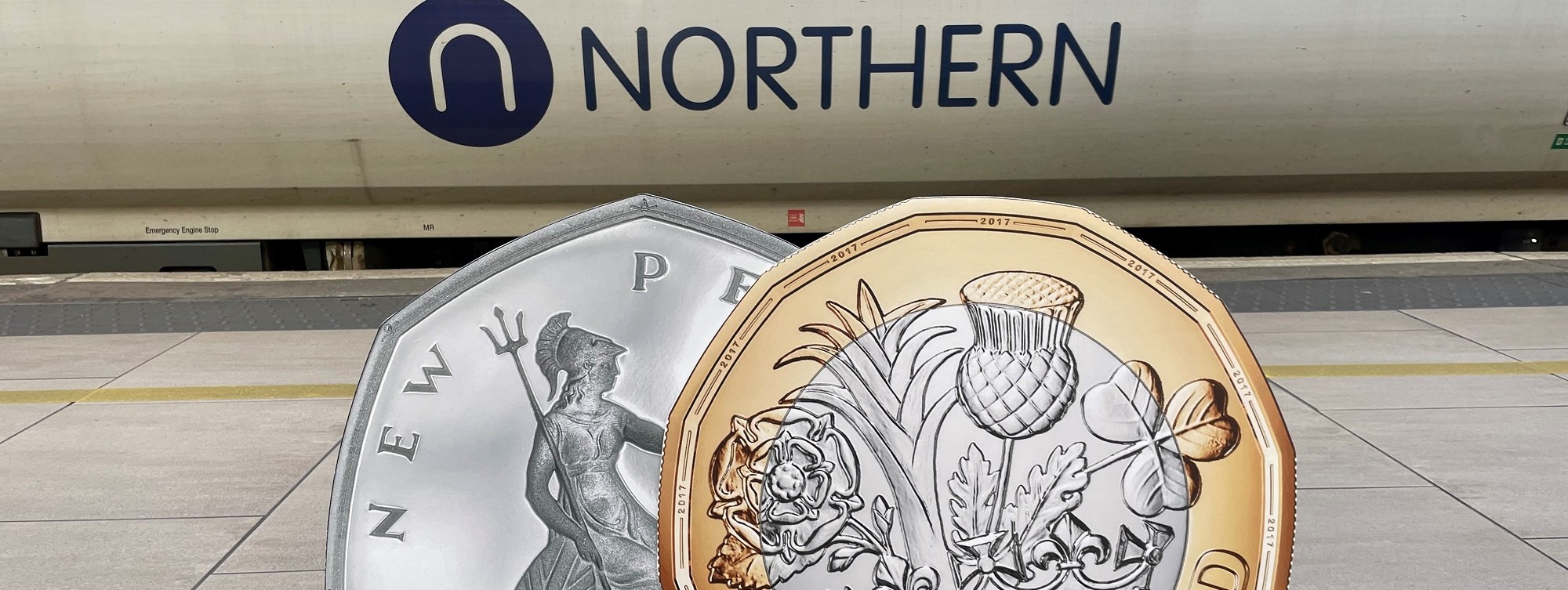 image-shows-1-coin-and-50p-piece-alongside-a-northern-train-2