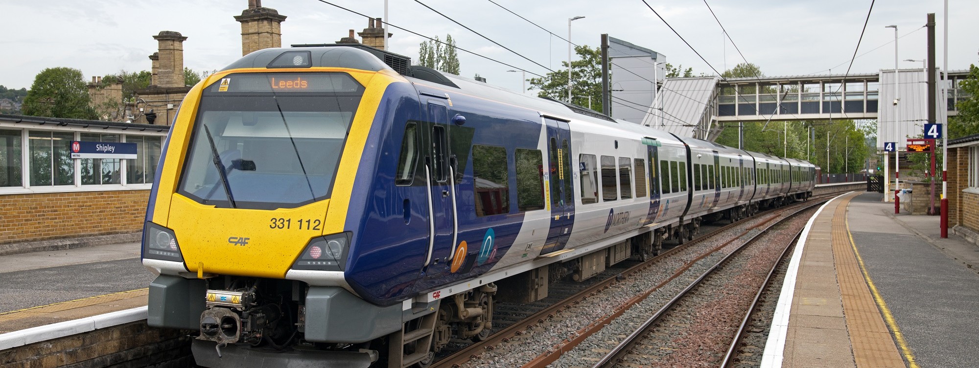 a northern train arriving into shipley station