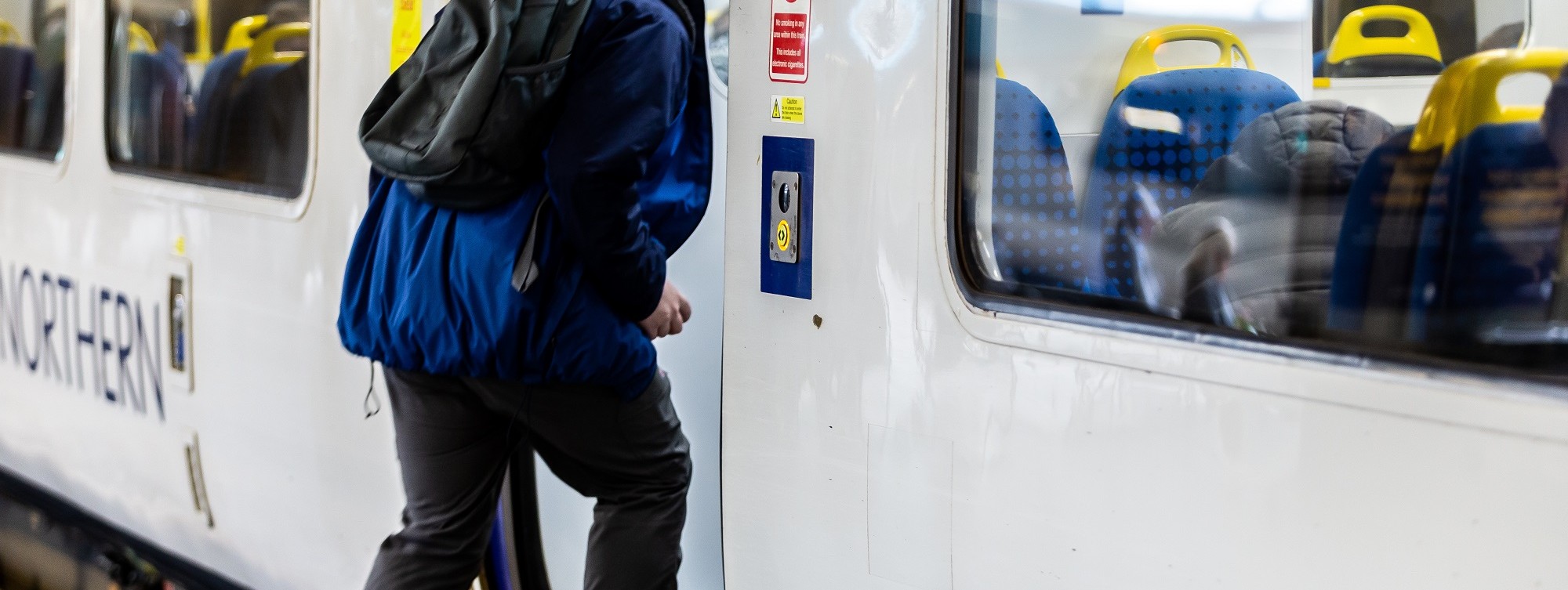image-shows-customer-boarding-a-train