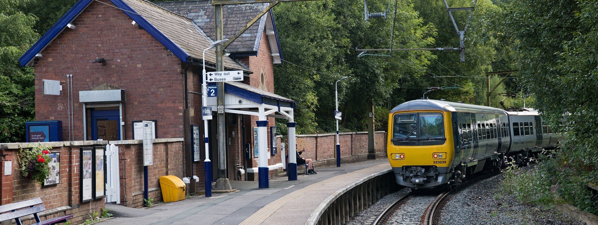 image-shows-passenger-sat-at-station-as-northern-train-arrives