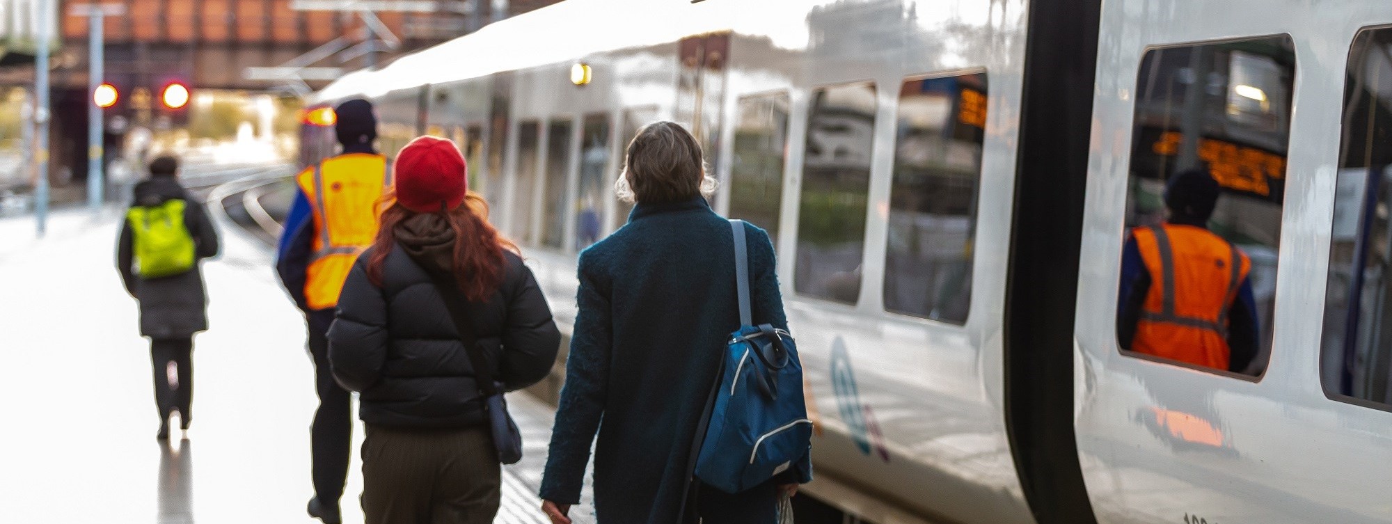 image-shows-two-customers-boarding-a-northern-train