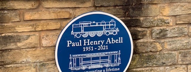 the-blue-plaque-at-ashburys-station-commemrating-paul-abell