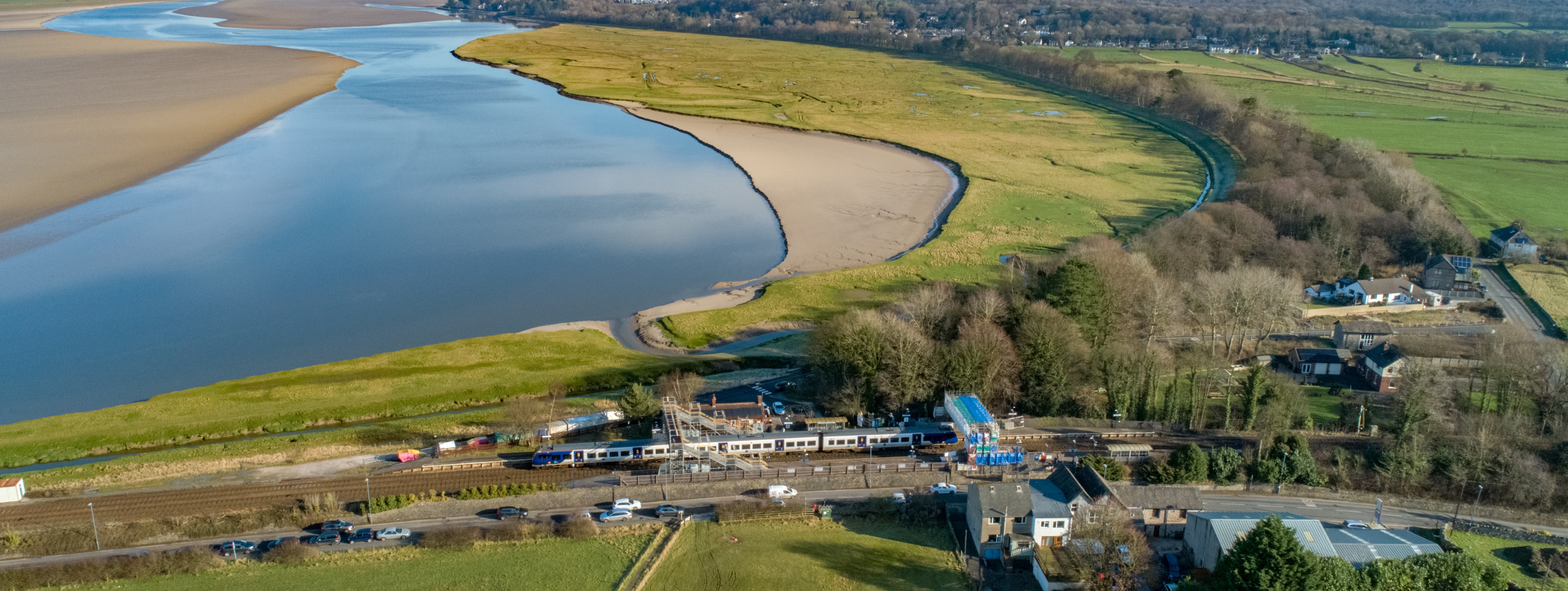 this-image-shows-a-northern-train-travelling-past-arnside