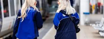 This image shows two female Northern staff members at a station this-image-shows-two-female-northern-staff-members-at-a-station