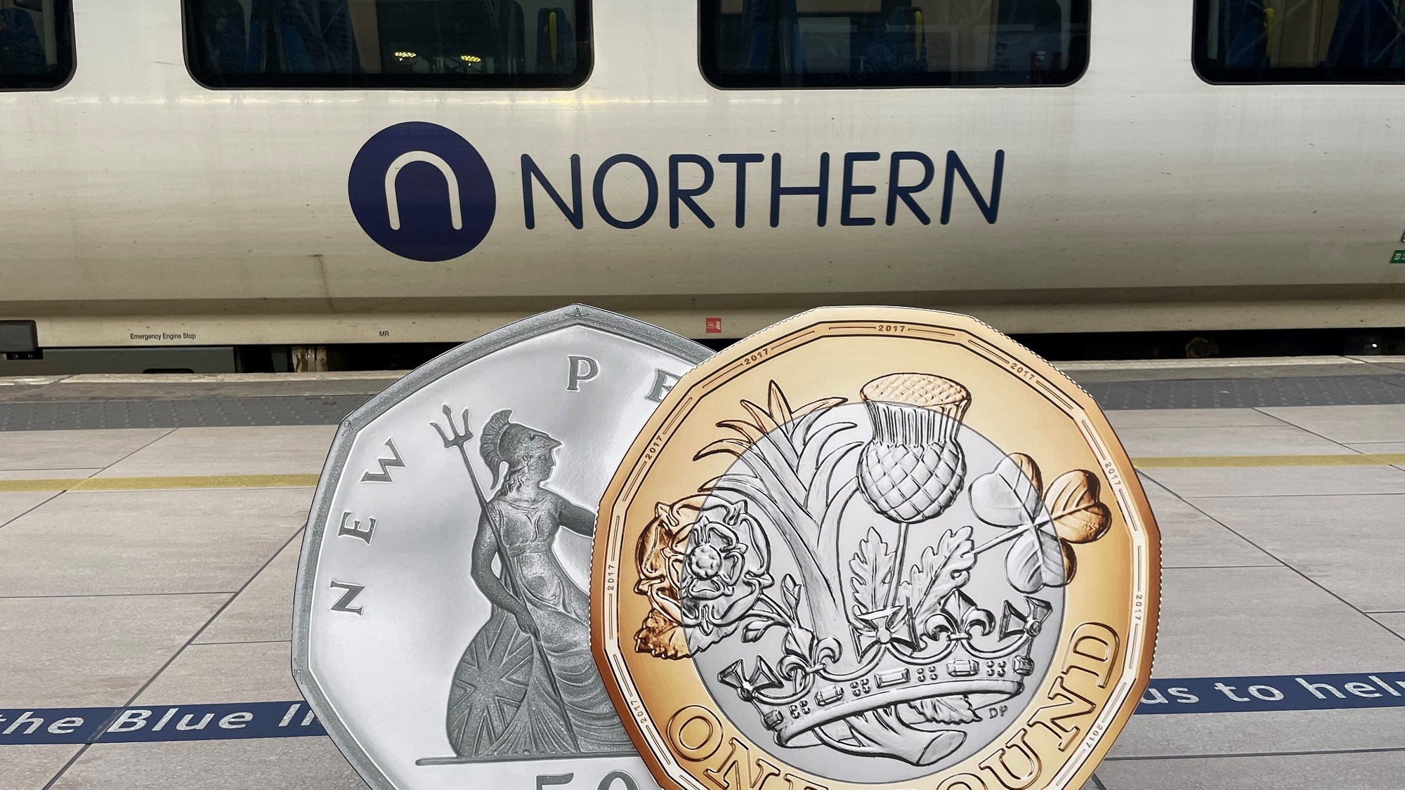 Image shows £1 coin and 50p piece alongside a Northern train-2