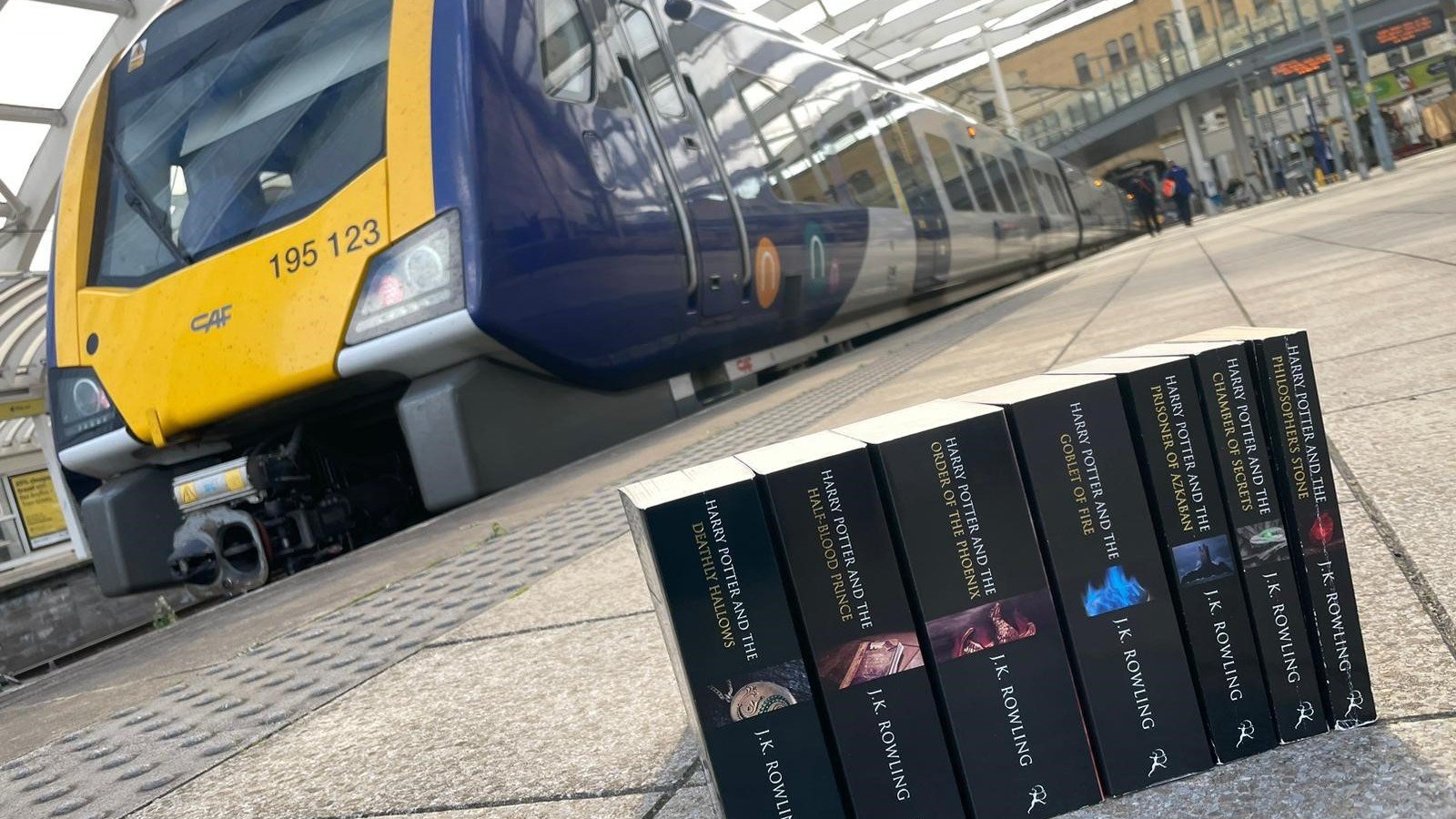 Image shows Harry Potter books alongside Northern train