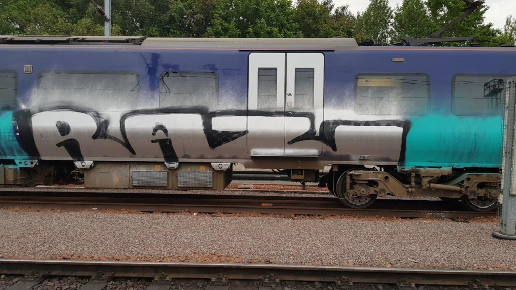 Image shows graffiti on Northern train at Heaton depot