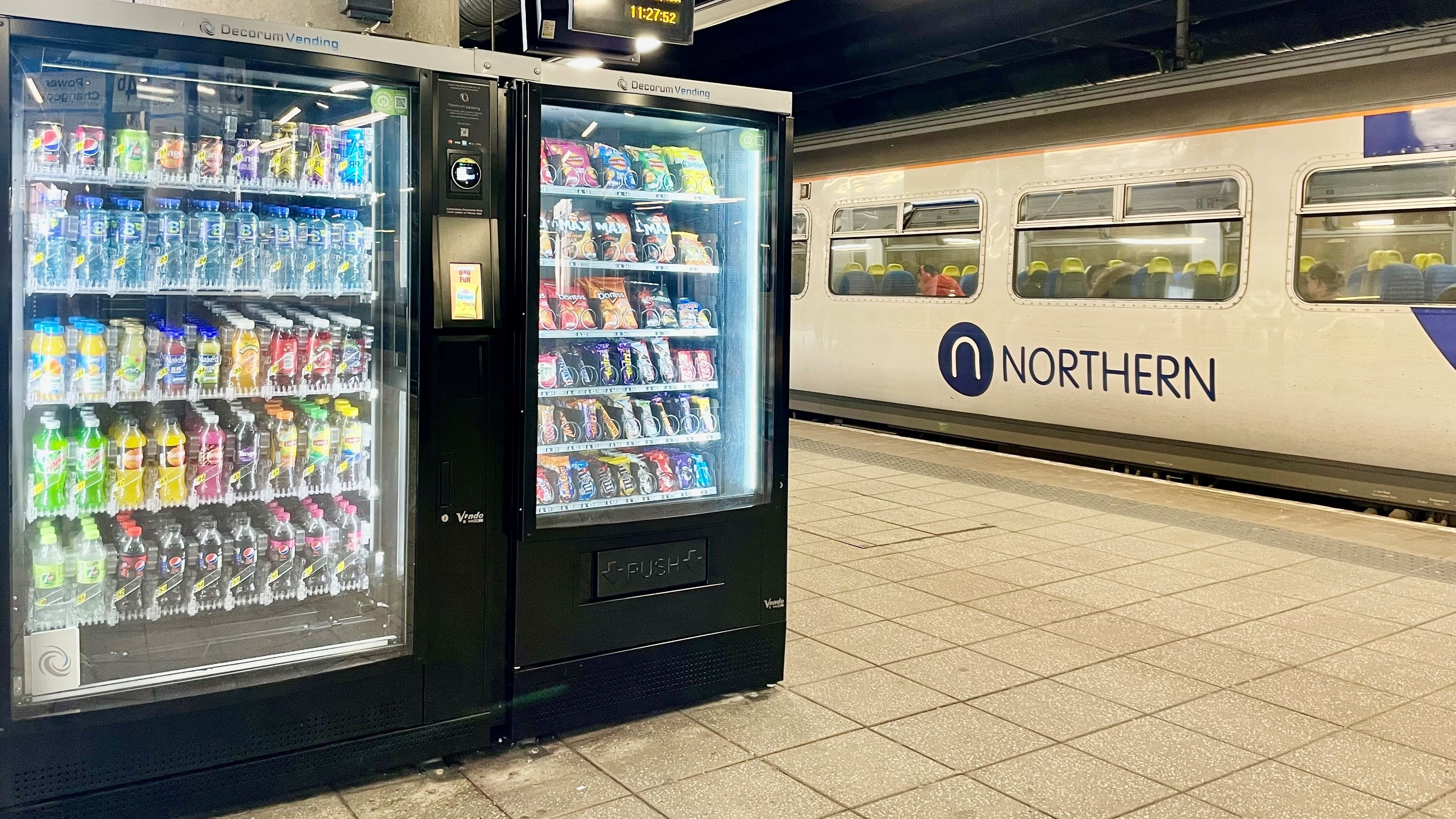 Image shows vending machine on platform with Northern service-2