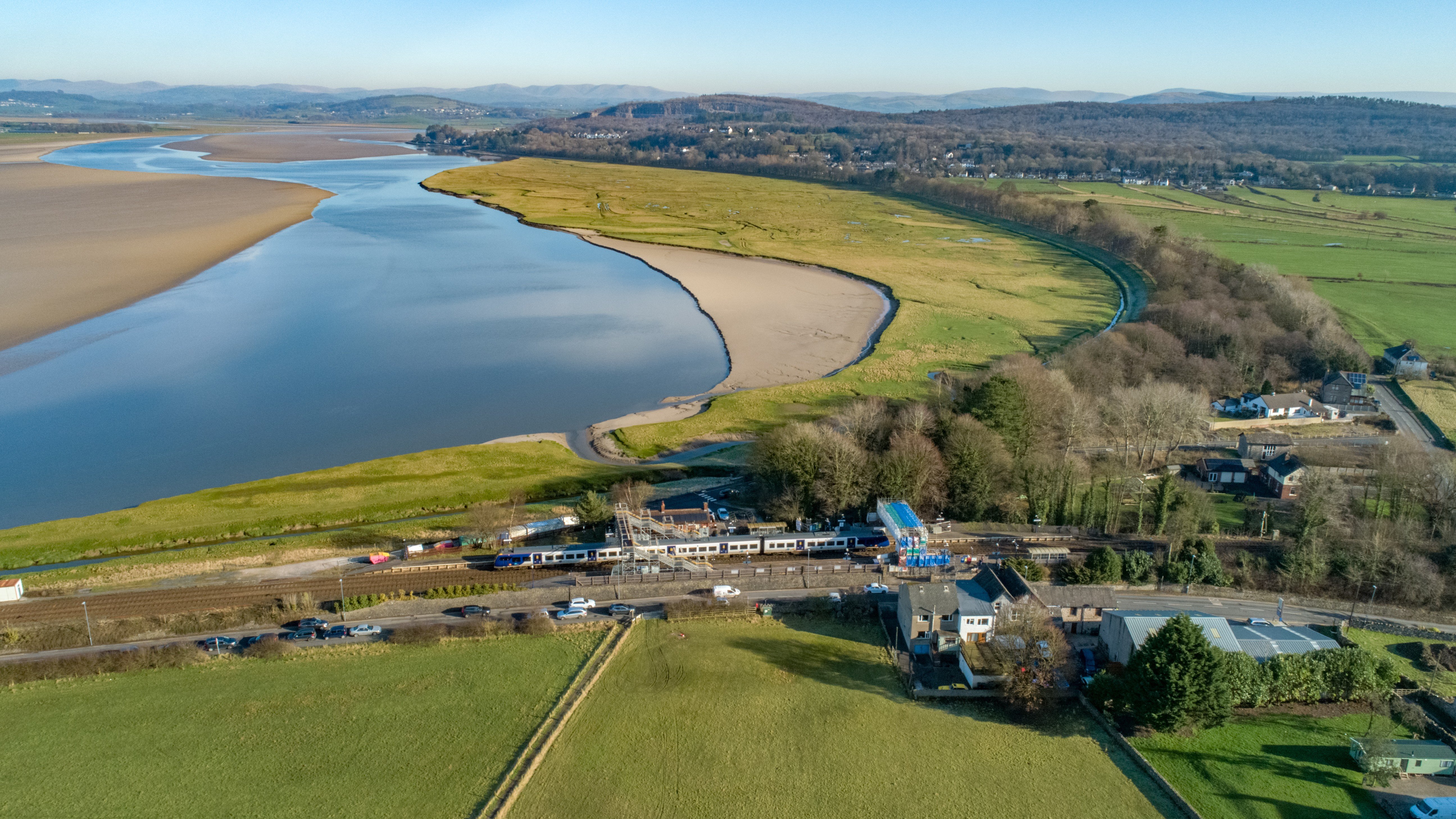 This image shows a Northern train travelling past Arnside