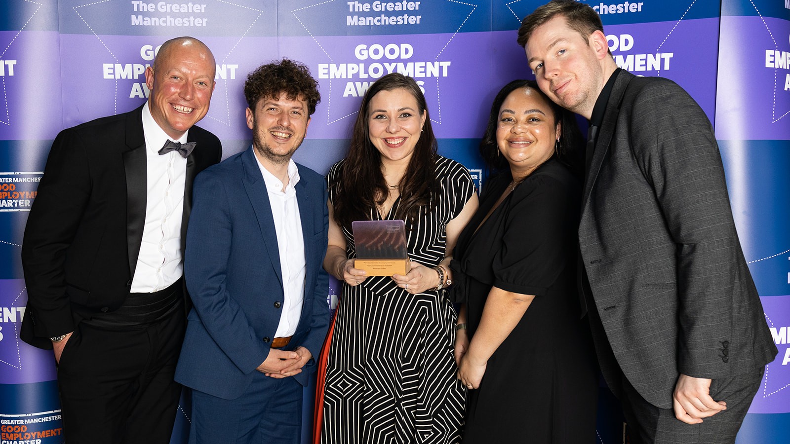 This image shows the Northern team holding their award
