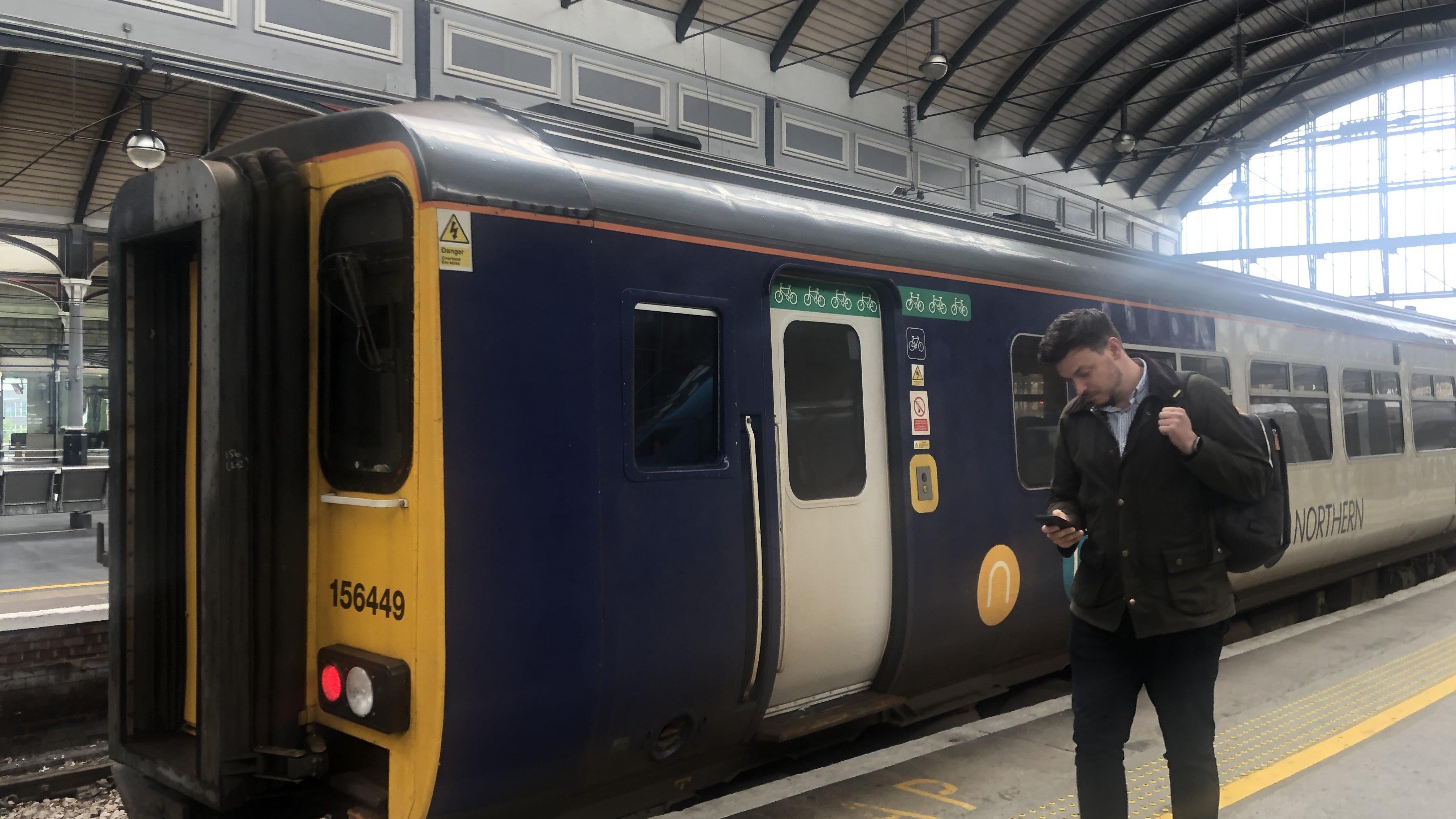 This image shows the new whatsapp service being used next to a Northern train