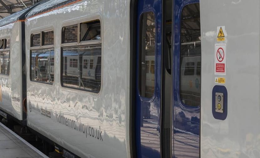 Northern train waiting at a station